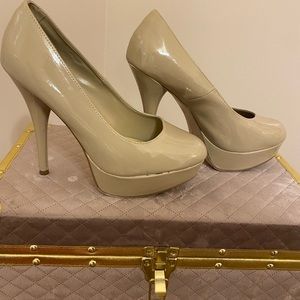 Nude glossy heels